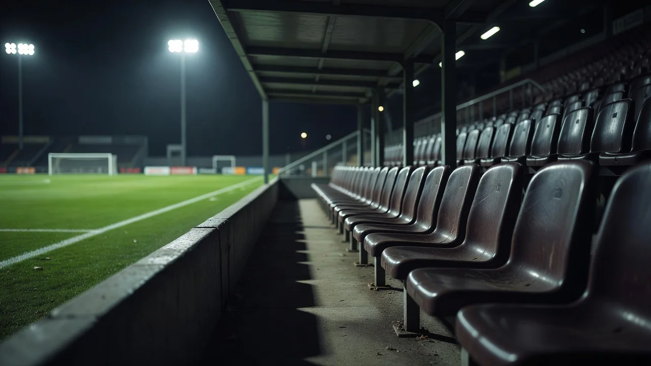 Empty touchline bench seats in a dugout before a match